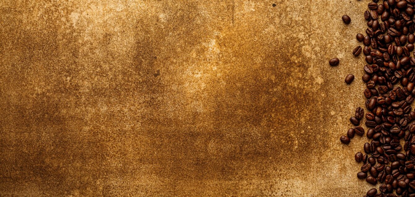 a grungy background with coffee beans on it
