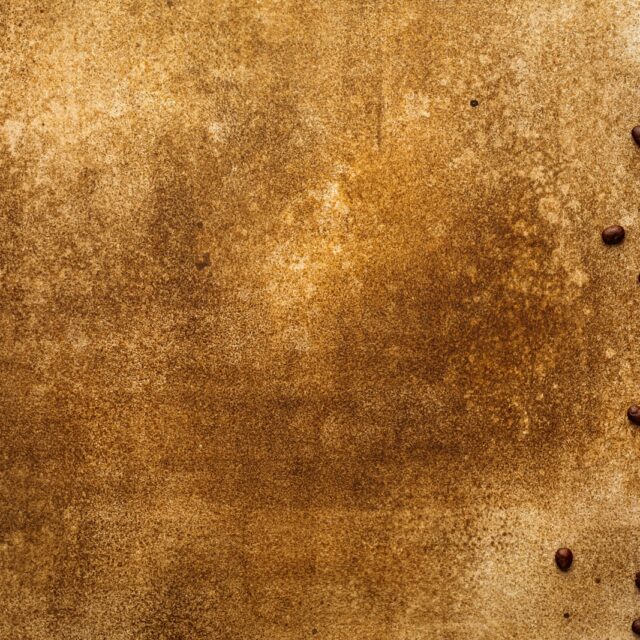 a grungy background with coffee beans on it