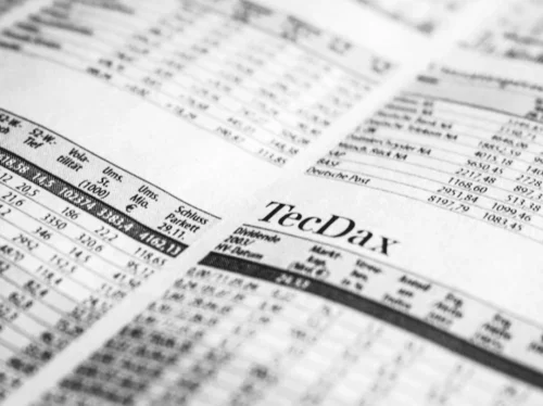 Photo by Markus Spiske Close-up of a printed stock market report in black and white, highlighting stock prices.