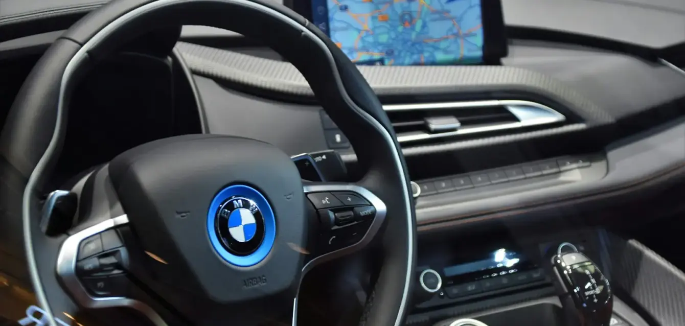 shallow focus photo of black BMW steering wheel