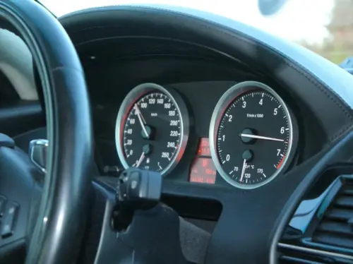 a close up of a speedometer in a car